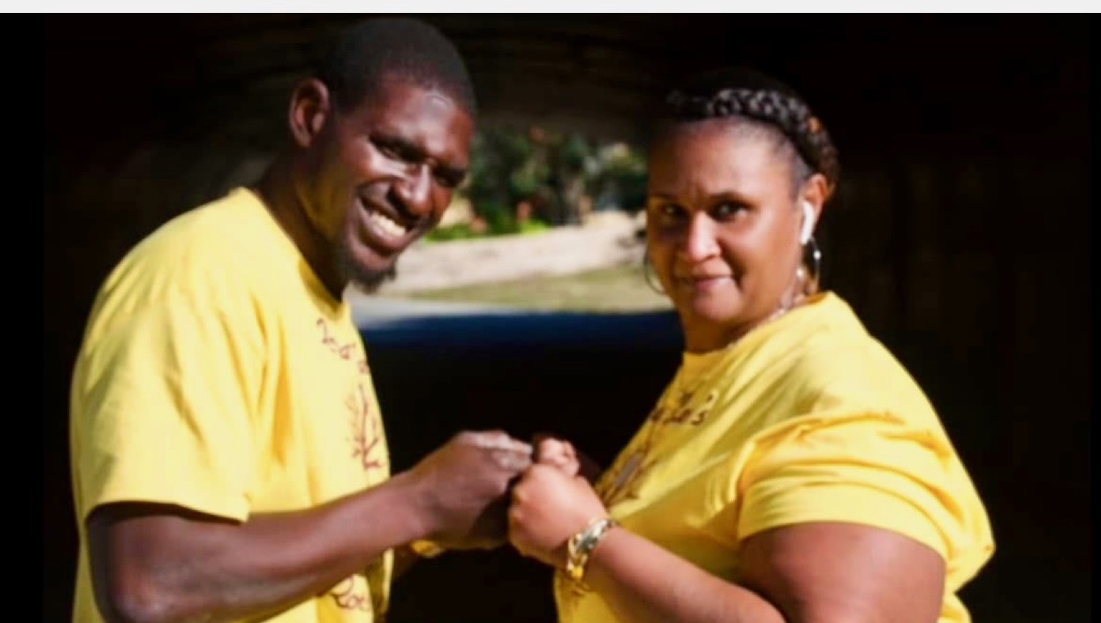 Cartez smiling alongside his mother